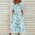 Blumige midi-kleid - lebhaftes damenblumenmuster kleid